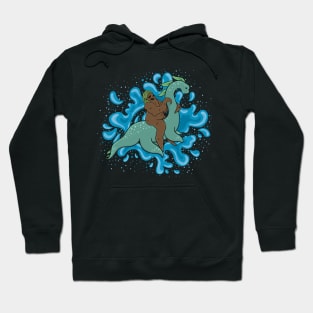 Sasquatch riding a Nessie Hoodie